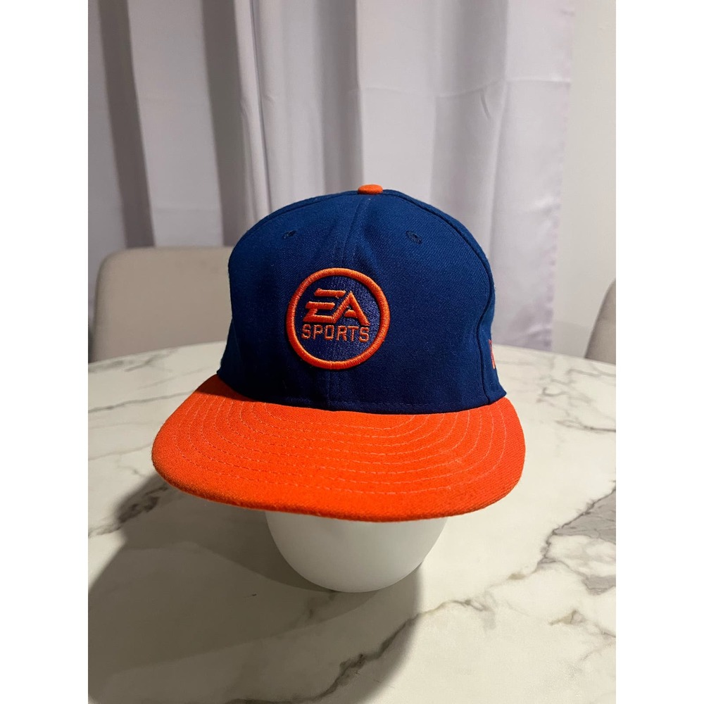 VTG EA sports cap New Era Blue & orange size 7 3/8 “it’s in the game”
